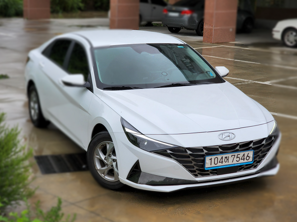 Hyundai Avante CN7, shown in a full-body exterior view as an example of the Compact / midsize sedan rental class