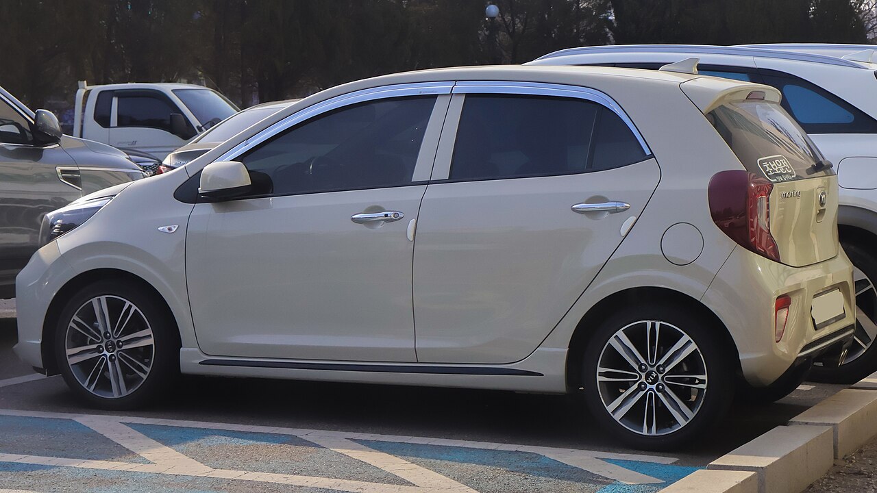 Kia Morning JA, shown in a full-body exterior view as an example of the Mini / economy rental class