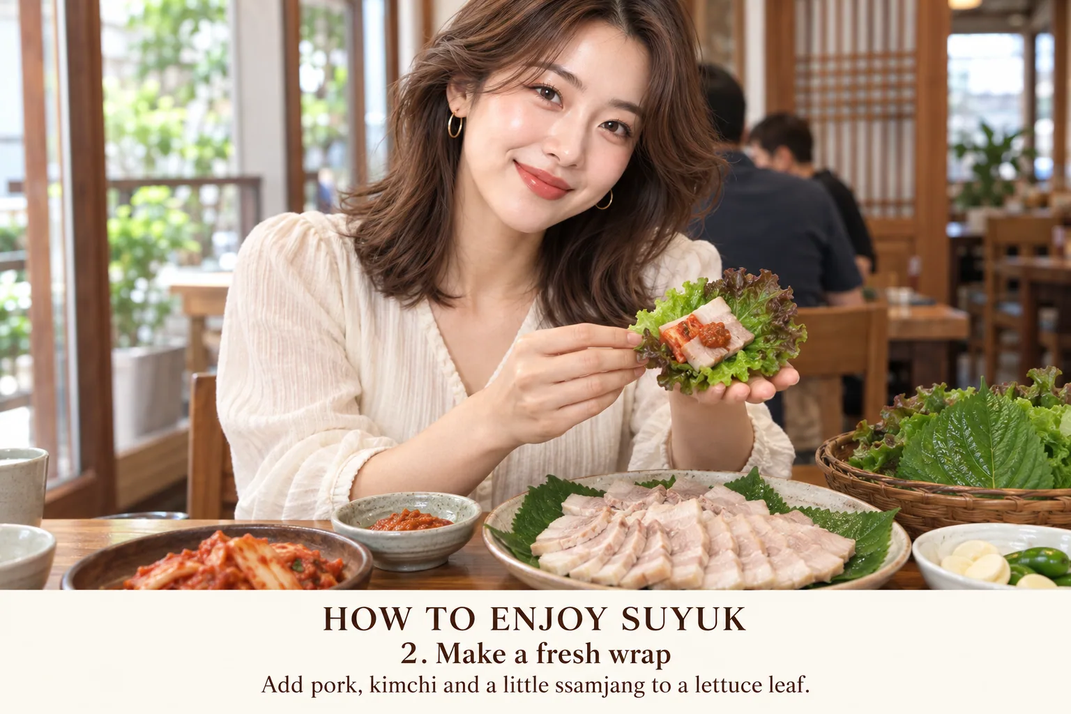 2. Build a small wrap with one leaf, one slice of pork, a little kimchi and about ½ teaspoon or less of ssamjang. Add raw garlic or chili only if desired.